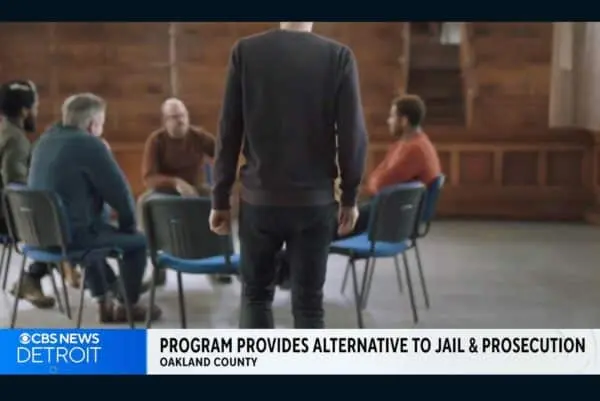 focus on person with a meeting memebers behind