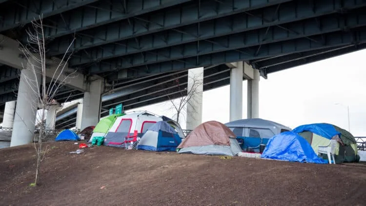 group of tents under an underpass