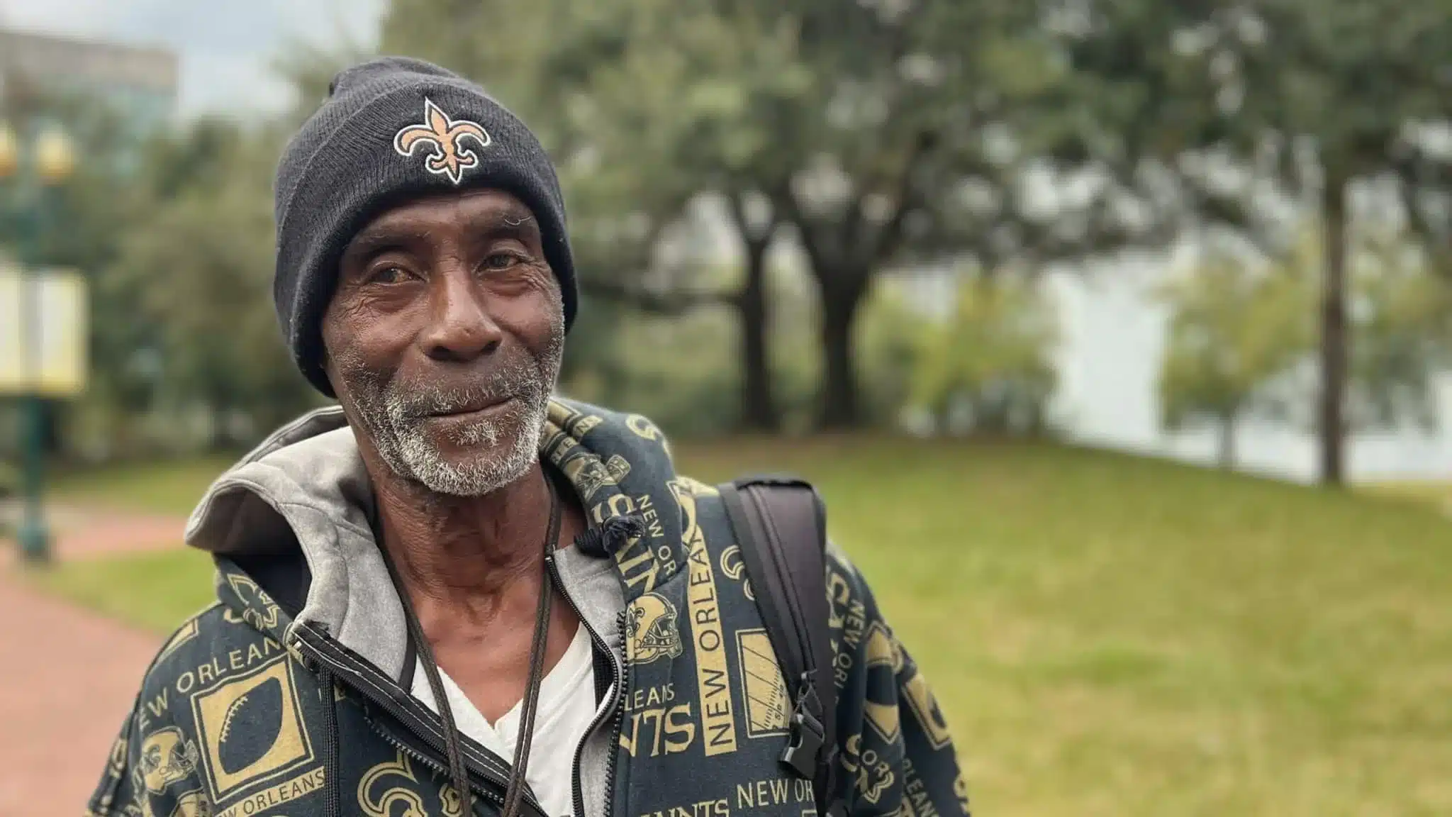 Black community member with New Orleans Saints beanie in public park